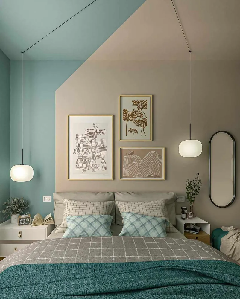 Globe pendants hang beside a bed at different heights.